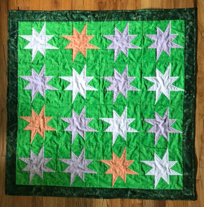 Finished the Celestial Star quilt. Started as a guild challenge quilt: randomly pick 3 crayon colors from a bag, add white or black, any border. My colors: green, pale purple, orange. #quilting #sewing #crafting