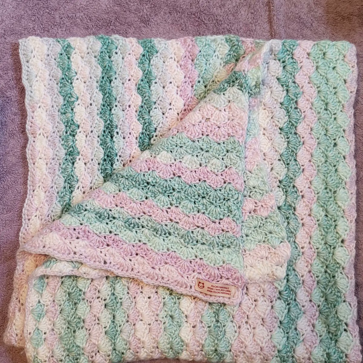 AlyCatCreations's tweet photo. The blanket is finally ready for your baby-or your friend's baby #babyboy #baby #babyblanket #blanket #crochetblanket #crochet #shellstitch #babyshower #sprinkle #shower #baby #newborn #babygift #babylove #cribblanket #strollerblanket #etsy #babygirl https://t.co/4kcZaUJsL2 https://t.co/yYbgqmQI9B