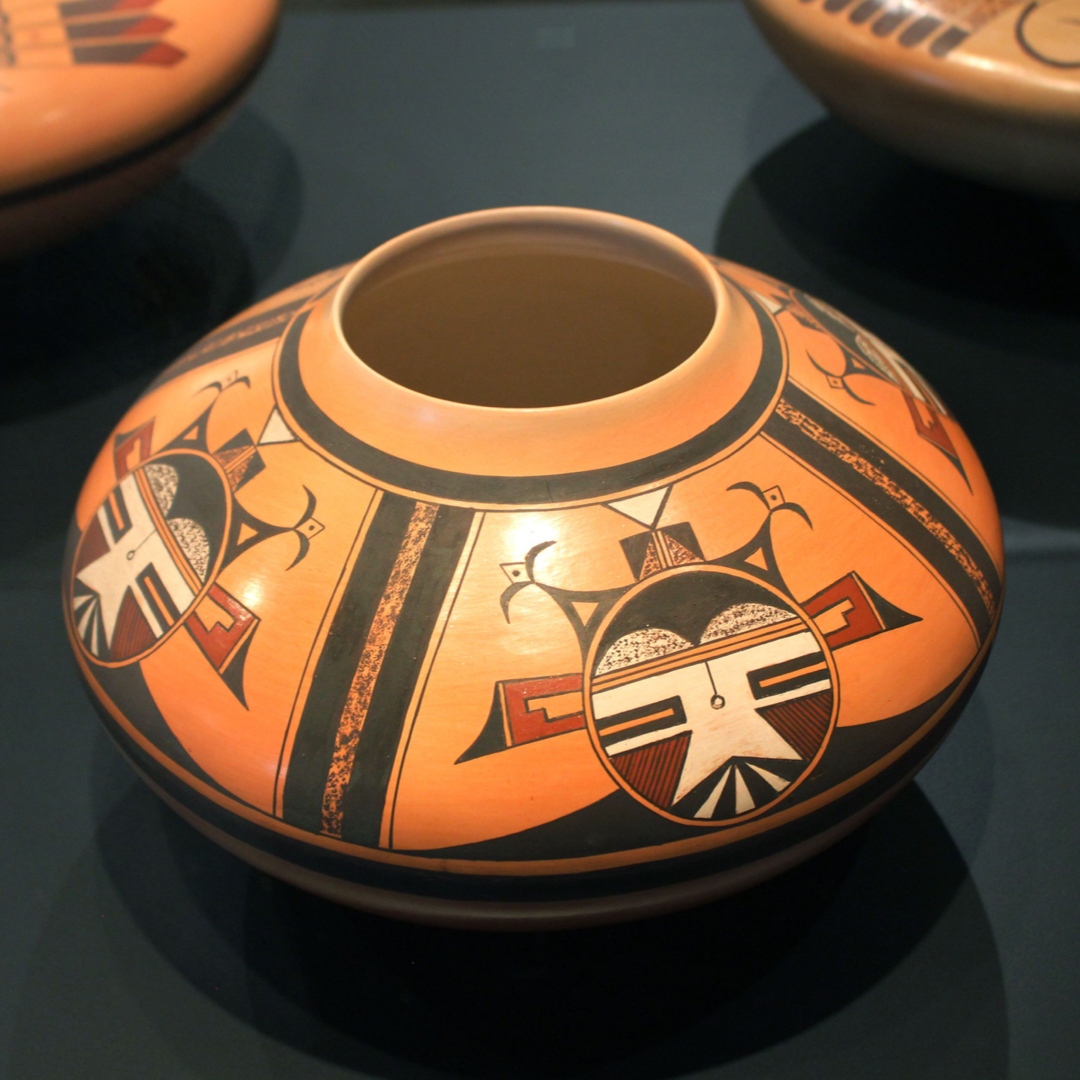 The Katsinas depicted in this jar's design are Shalakos, who represent the sacred cloud people.

Art: Steve Lucas, Jar with Katsina Design, 1998. Ceramic. Gift of The Allan and Judith Cooke Collection