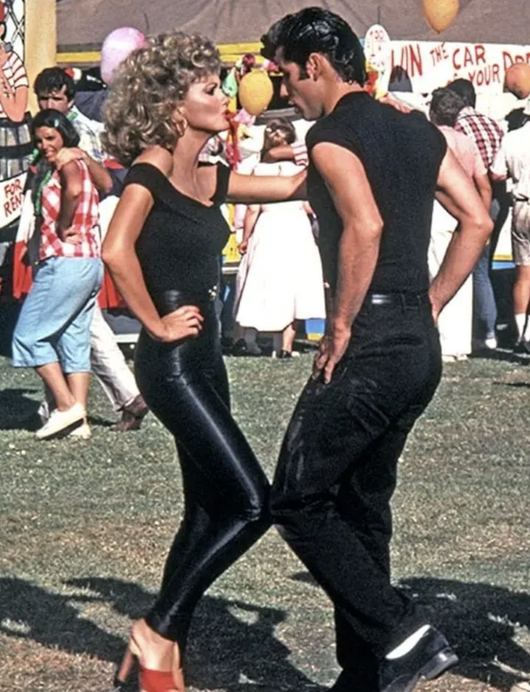 BuzzFeed's tweet photo. Speaking of Spandex, Olivia Newton-John's pants were so tight when filming "You're the One That I Want," that she had to be ripped out of them and sewn into them. https://t.co/GyrVkqwxLx