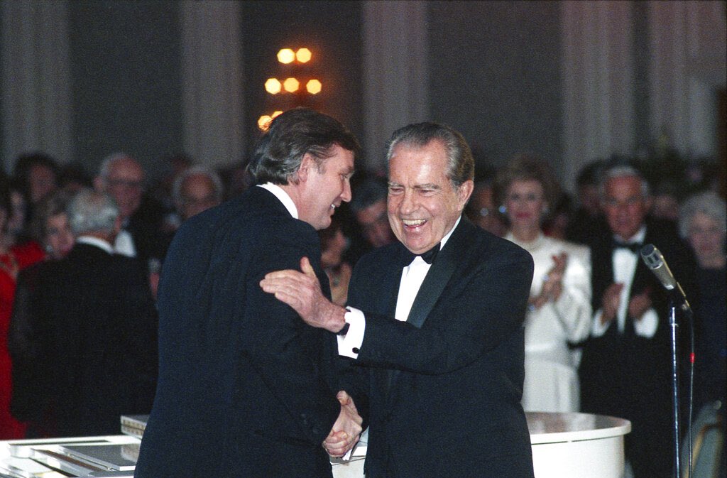 Here is a picture of the most corrupt President in American history and Richard Nixon.