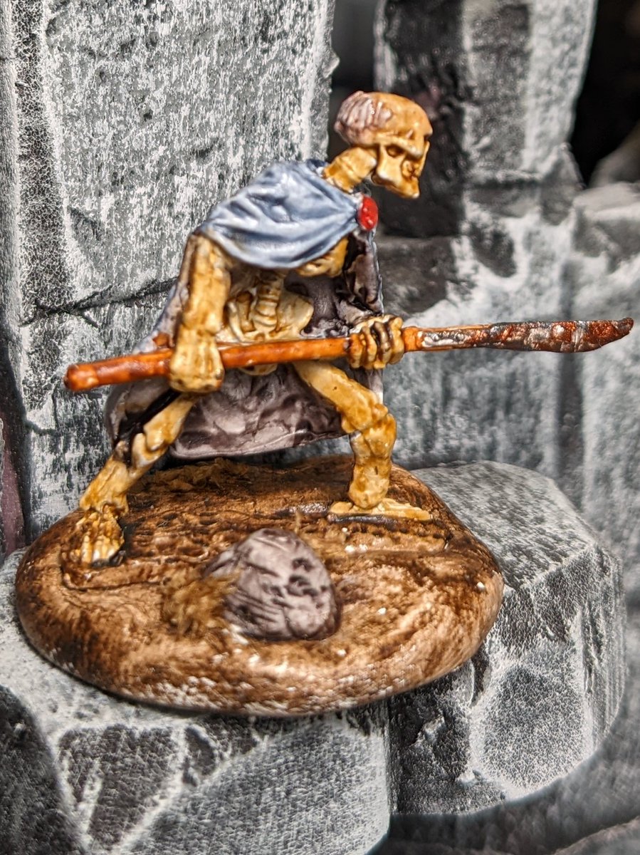 Sargent Brontel Burb always struggled with his weight as a soldier as he loved mead and sweets and was often in a guard house. Since meeting Necromancer Crext he has been nothing but cloak and bone! #paintedminiatures #dnd #dnd5e #miniaturespainted #frostgrave #DnDcharacter