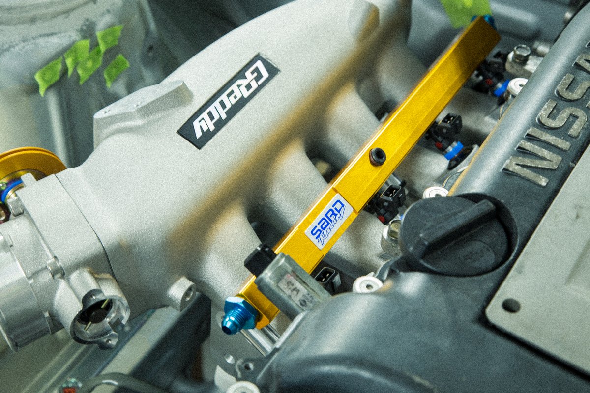 EsotericS15's tweet photo. Speedtek Trust mid mount style manifold, Garrett GTX3071R, AEWorks coolant swirl pot, Trust intake N15 flange manifold, NAPREC 80mm N15 throttle body, SARD fuel rails + 900CC injectors, DC Engineering 180 amp alternator. I'm very confident in this setup. https://t.co/ChJ09FxNQx