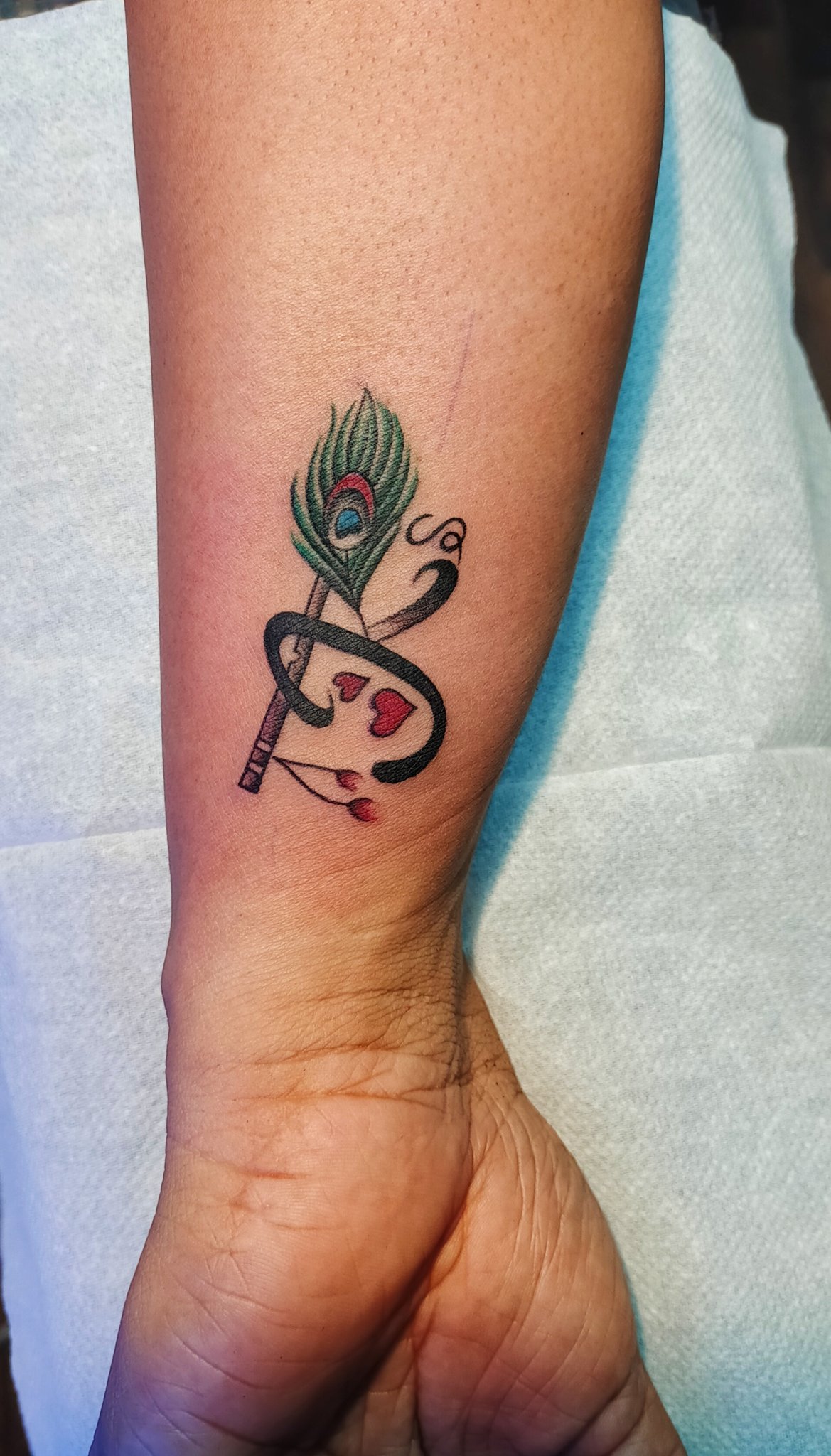 krishna with morpankh tattoo done at xpose tattoos jaipur