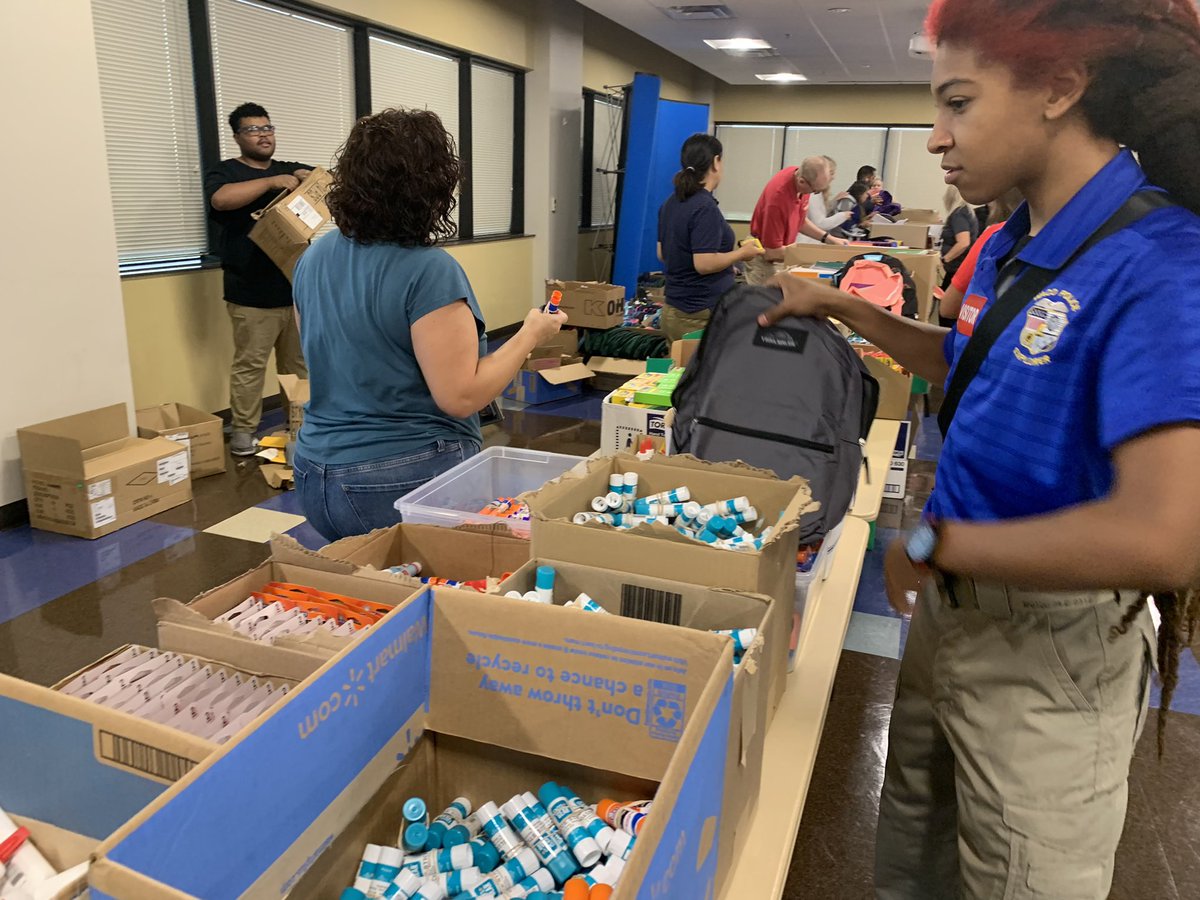 WacoPolice's tweet photo. We are busy stuffing our hundreds of backpacks for this Saturday’s Back to School Bash!! Join us from 8 a.m. to 3 p.m. at the BASE @ Extraco for some free school supplies, a back pack and more! https://t.co/2D1L4MWJWw