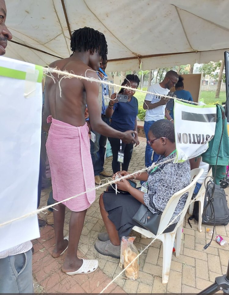 ZimEye's tweet image. pictures-#KenyaVotes2022 Kenyan man turns up to vote in a towel and with a toothbrush in his mouth. Says “my friend turned up and said he was going to vote & i could not be left behind.”