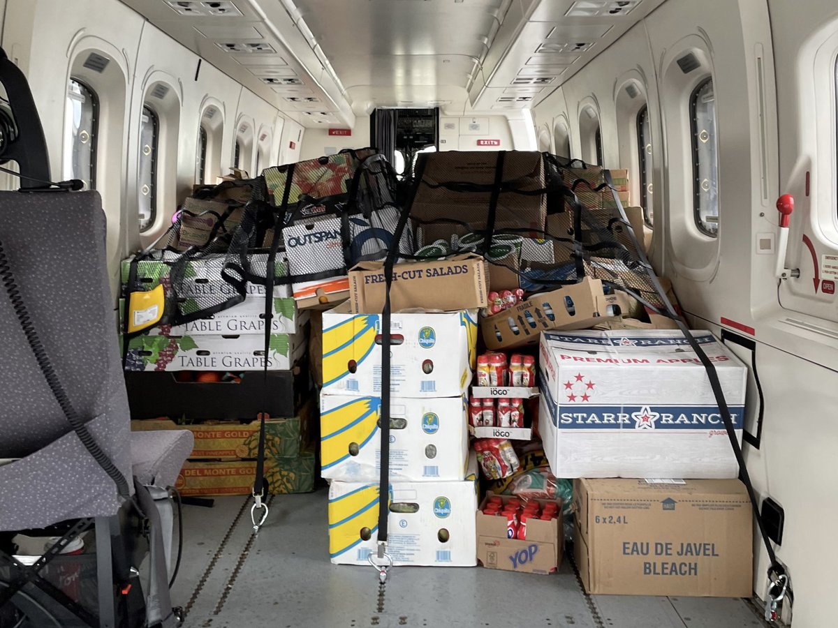 GovNL's tweet photo. 🙏 Shout out with gratitude to Cougar, RMS Pope, and all of the incredible Harbour Breton volunteers who helped unload supplies today. #NLFire #GovNL https://t.co/nFPFhY3TGC
