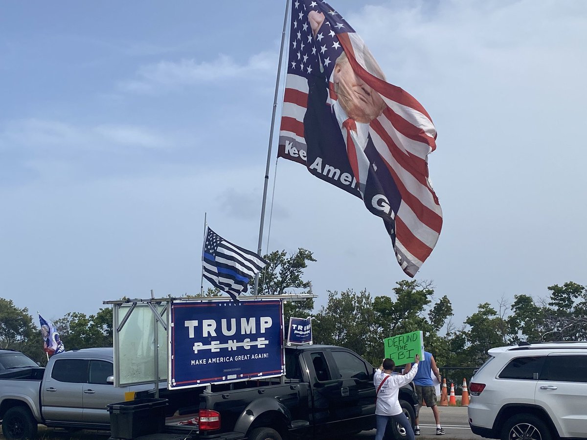 C_A_Heath's tweet photo. Crowds packing in on the bridge leading to Mar-a-Lago https://t.co/dTlV9OpMVx