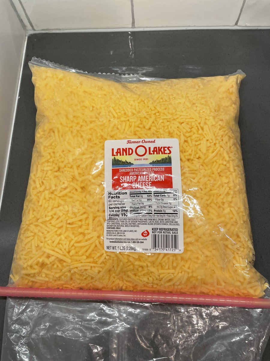 timcurry0030's tweet photo. i visited my Nana this weekend and she wouldn’t let me leave without taking this 5 lb bag of shredded American cheese https://t.co/Cpn87qTFbr