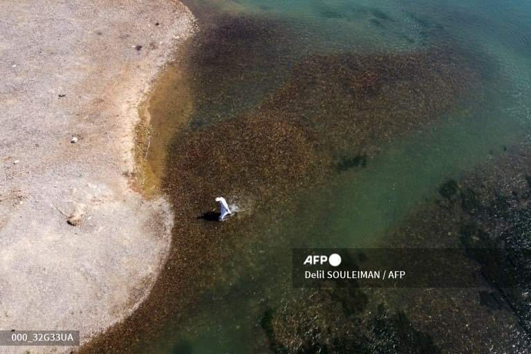 Aerial pictures taken by drone on August 5, 2022, shows a general view ofthe #Euphrates river in low #water levels in the western country side of #Raqa on August 5, 2022.
<a href="/Delilsouleman/">Delil souleiman</a>  / <a href="/AFPphoto/">AFP Photo</a>