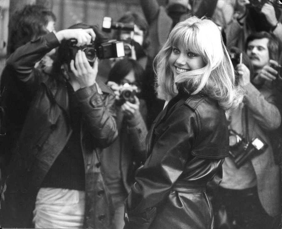 Olivia Newton-John greets the press in 1978. 

Bandphoto/Starstock/Photoshot/Everett Collection