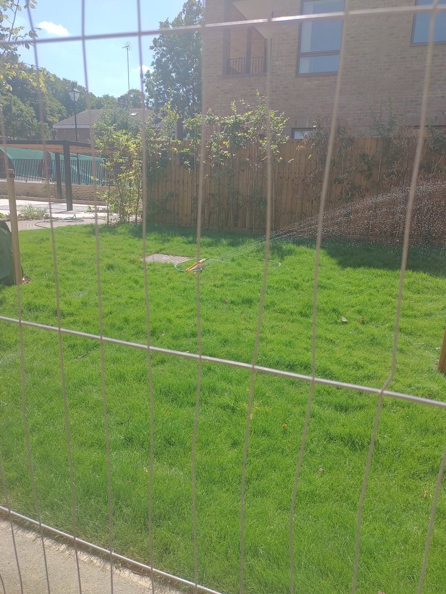 mauimau's tweet photo. There's a hosepipe ban coming in London and water shortages in the UK. Yet in @lb_southwark this unused, uninhabited grass in an unfinished development in Nunhead is watered with sprinklers. Anyone's grass this green ATM? https://t.co/QHpOXrCoQW