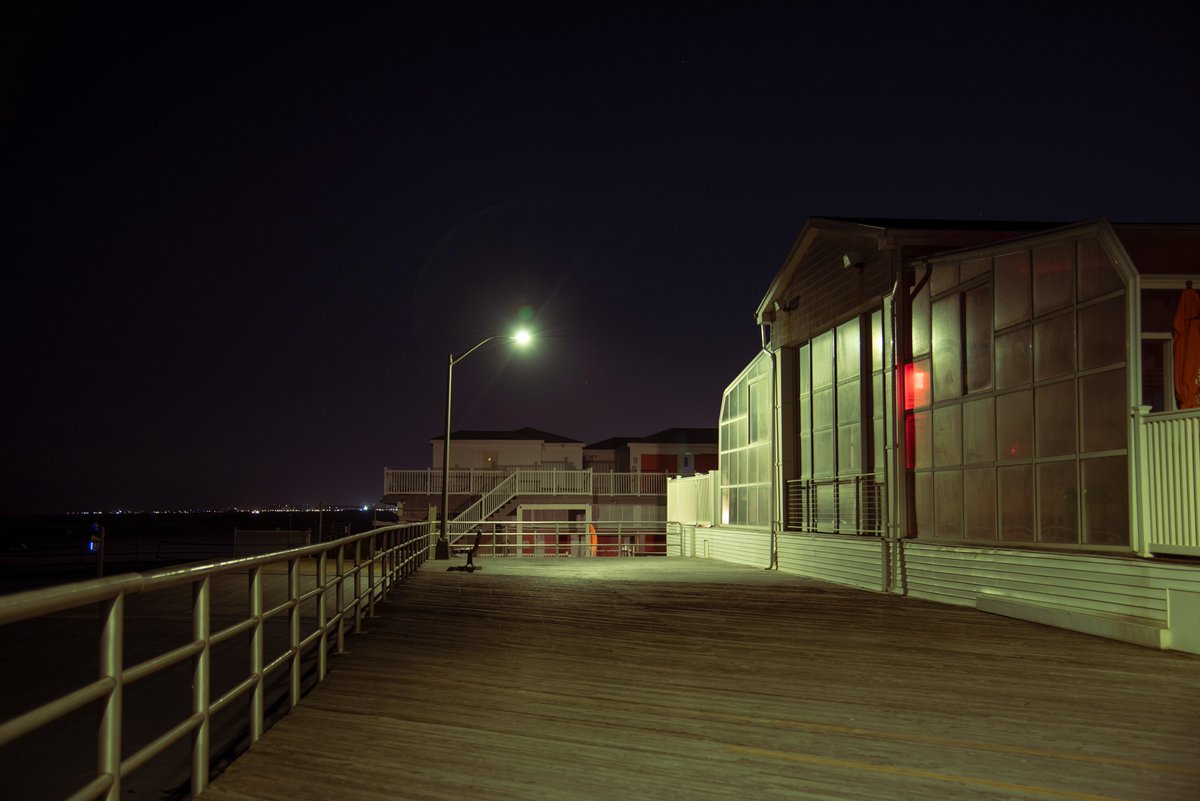 rock_hyrax's tweet photo. It was still 88 degrees in the apartment at 11pm, so I night-biked to #AtlanticBeach, met some #ghosts on the #boardwalk. #overnight #photography https://t.co/HNW031csiD