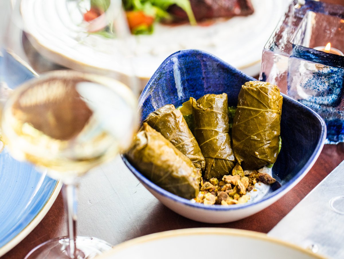 Our hand-rolled Grape Leaves are on the Happy Hour menu, and when paired with one of our Happy Hour wines, you have the perfect post-work treat.