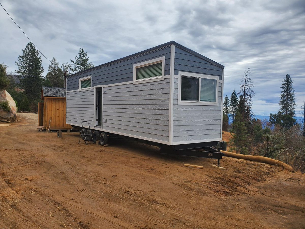 OpTinyHome's tweet photo. Through the support of our partners at #RebuildOurSierra &amp; many other Operation Tiny Home donors, we provided Mark w/ a $54k grant that allowed him to purchase his new home at a deep discount. Visit our Facebook page to see the photo album of his new home: https://t.co/GkldL6ctCR https://t.co/KU67TnqgTJ