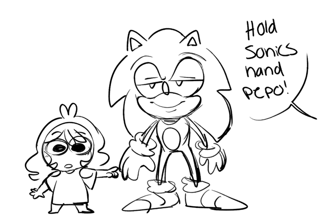 pepo at the gaming museum taking a picture with the sonic statue 