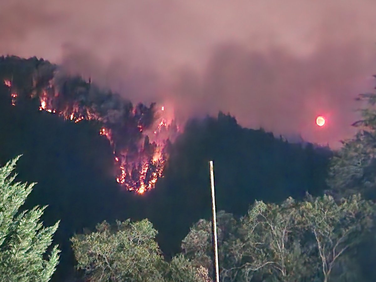 Night view of the Campbell Fire on the #SixRiversLightningComplex from fire camp.