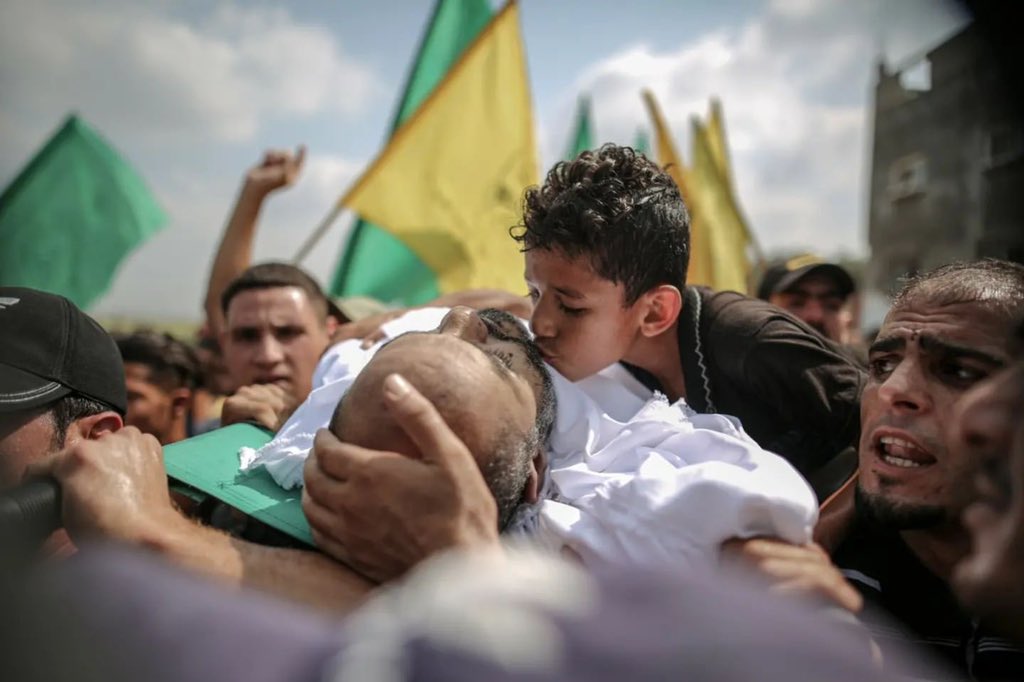 MuhammadSmiry's tweet photo. A Palestinian kid from Gaza during his father's funeral. https://t.co/162Ile3UQZ