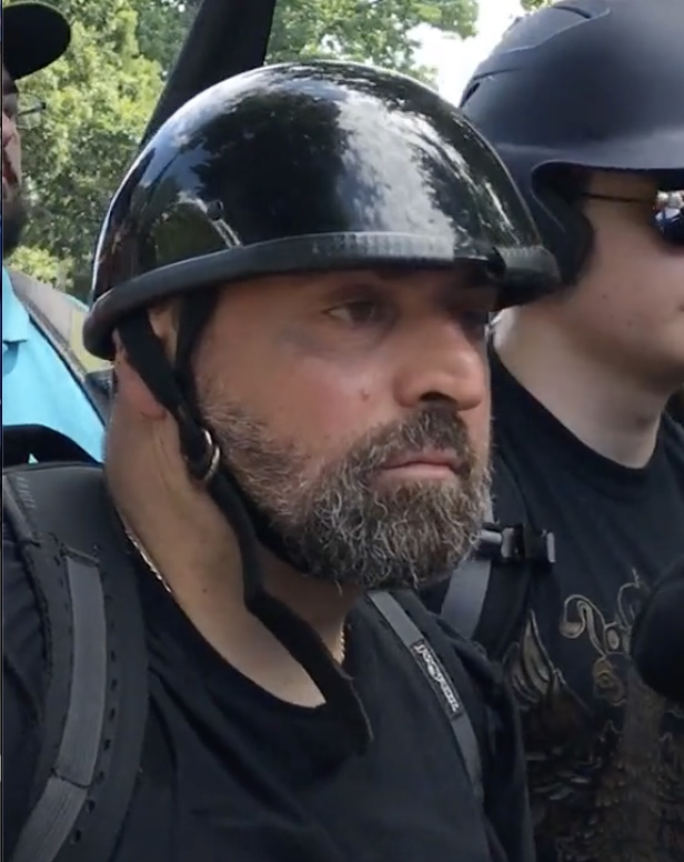 PacAntifa's tweet photo. How many attendees of Unite The Right in 2017 also attended the January 6th attack in DC? Here is one white supremacist who attended both rallies. We need your help identifying him. Left: Aug 12, 2017 at UTR, Right: Jan 6, 2021 in DC. #IgniteTheRight https://t.co/vVMchYXxMm