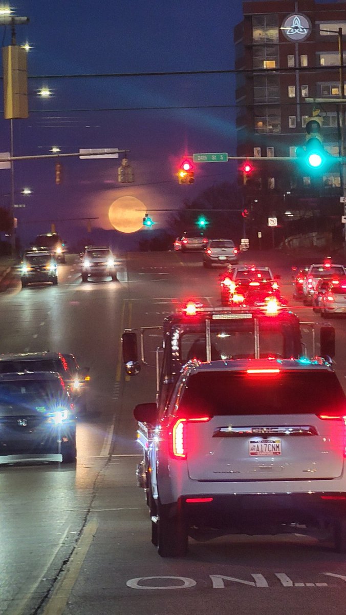 kd4zgn's tweet photo. I knew I shouldn't have left the Sony at home.  I hope someone got a good shot of this. Moon rising above Birmingham this evening.  Saint Vincent's hospital on the right.  10X zoom with the  Samsung Galaxy S21 phone thru a windshield. Ehhhh. @spann https://t.co/NS7kSumg9Z