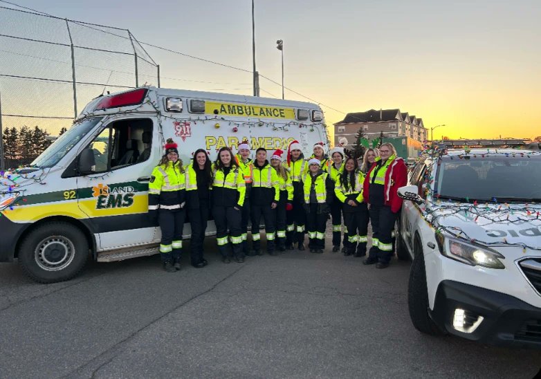 IslandEMS's tweet photo. Another successful Christmas Parade from the @CityofCharlottetown , #PEI. Beth, Courtney Breanna and Holland College paramedic students helped guide Santa safely into the city tonight as they participated in the Annual Santa parade. Great job to all Santas helpers. https://t.co/JmqLoNJ22z