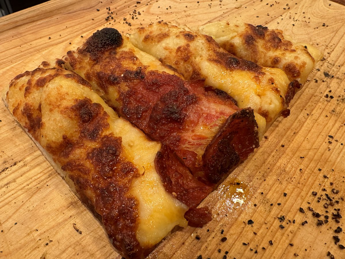 This is home made cheesehead by my 15 year old son, David. He made a scratch Béchamel sauce, added more cheese, some pepperoni, cooked in the <a href="/OoniHQ/">Ooni</a> pizza oven. 

It’s easily one of the best foods I’ve ever tasted EVER.