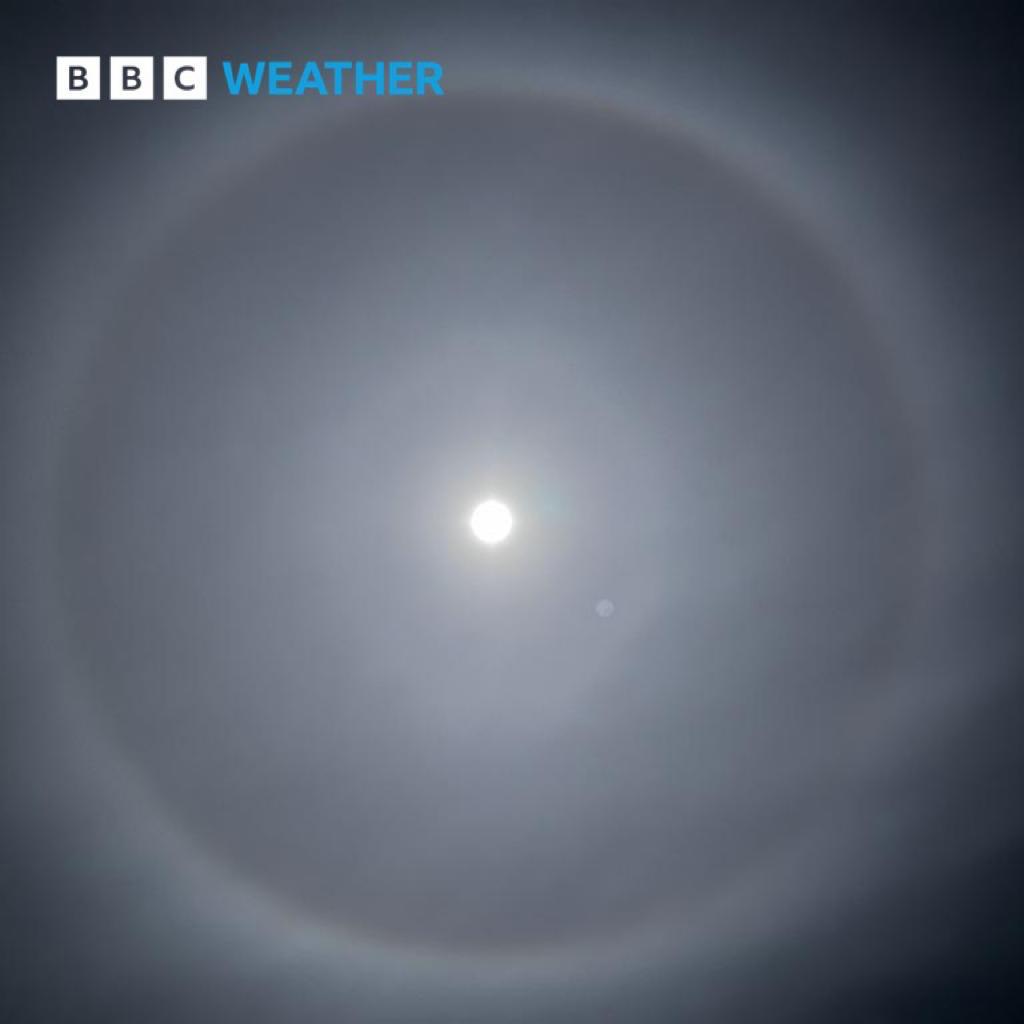 bbcweather's tweet photo. Did you spot the Moon halos last night? They form when the moonlight gets reflected and refracted by ice crystals in the air, creating a white halo around the Moon. 
📷 BBC Weather Watchers pacamac in Ashbourne, Elainey in Chichester, Rebekah in Appleton, MikeyTage in Padiham. https://t.co/8vCGMoXgmN