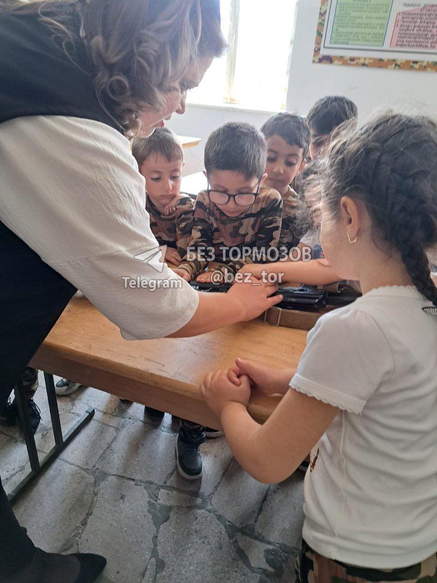 ScourgeOfTengri's tweet photo. This is how Armenian fascists used to abuse small children in #Karabakh. Dressed them into military forms, taught them to hate Turks and use weapons to kill them. A total indoctrination into Armenian fascist ideology at school, at Church and at home. #⃣ #Azerbaijan #Armenia https://t.co/z7zCVchude