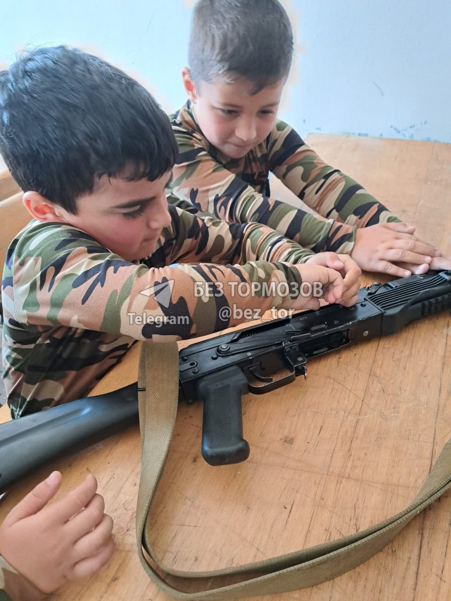 ScourgeOfTengri's tweet photo. This is how Armenian fascists used to abuse small children in #Karabakh. Dressed them into military forms, taught them to hate Turks and use weapons to kill them. A total indoctrination into Armenian fascist ideology at school, at Church and at home. #⃣ #Azerbaijan #Armenia https://t.co/z7zCVchude