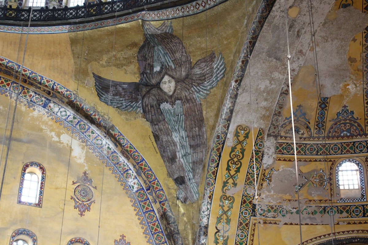 thehiddenfaceof's tweet photo. Hagia Sophia has got four Seraphim depictions, two of which are mosaic. Their faces were covered with a metal mask during the Fossati restoration and one of them was uncovered in 2009. The mask that was removed from the mosaic is now on display at Hagia Sophia History Museum https://t.co/9hclJdGbNH