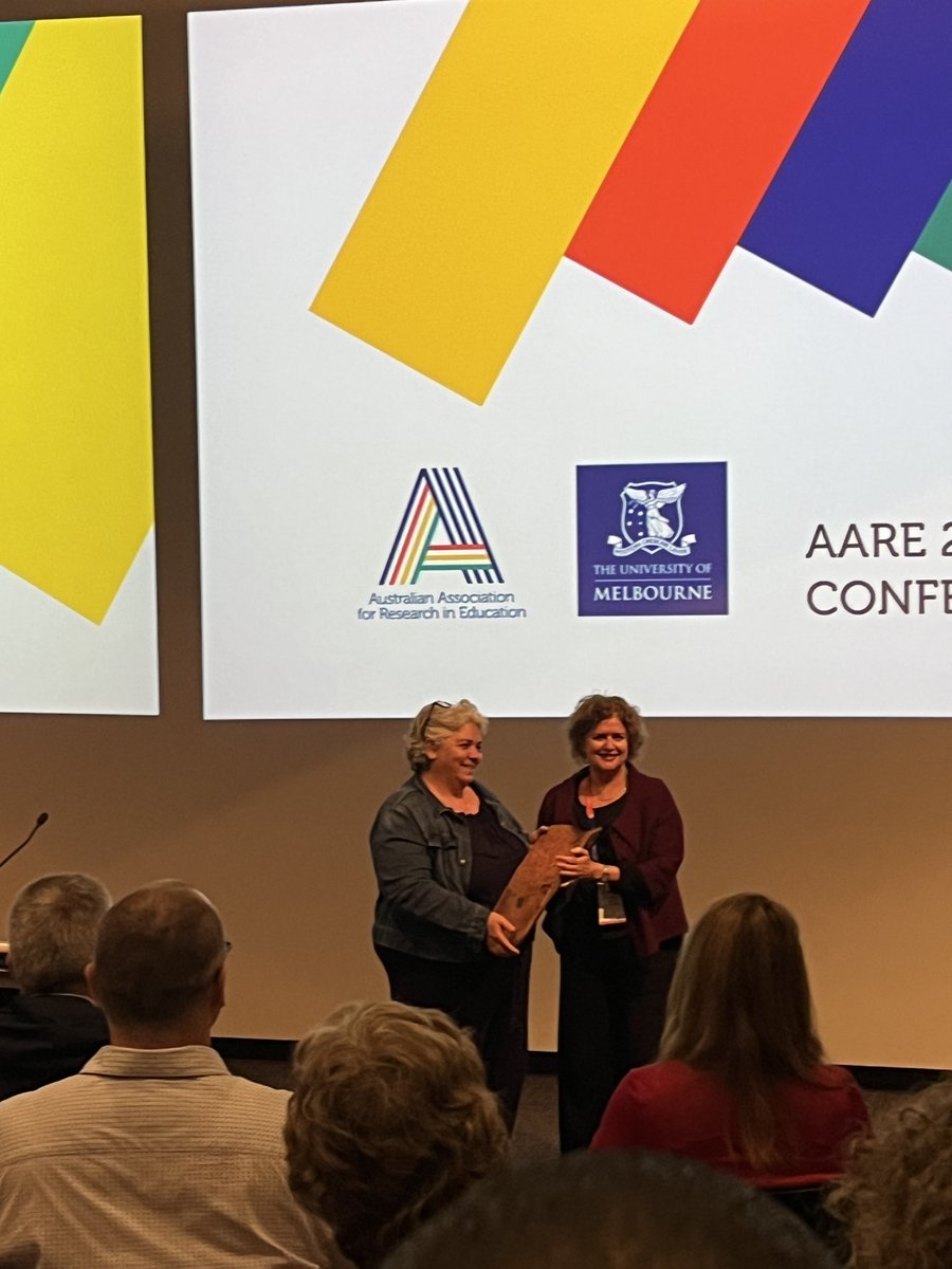 “The week of silence is over.” Prof Melitta Hogarth safely delivering the Coolamon to the conference this morning. #AARE2023