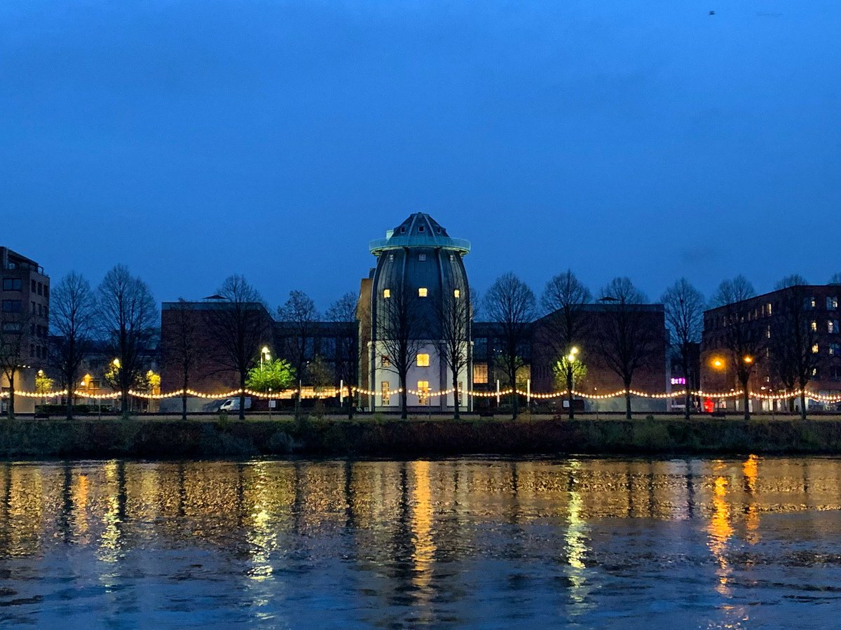 It is the season of dark blue skies and twinkly lights @MaastrichtU - looking across the river Maas at the @Bonnefanten museum, designed by #AldoRossi