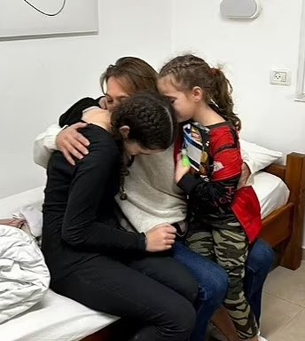 OliLondonTV's tweet photo. Ela Elyakim, 8, and Dafna Elyakim, 15 are reunited with their mother Maayan Zin after spending 51 days in captivity. 

On Oct 7th the young girls experienced a harrowing ordeal. 

Hamas came into their fathers home and held them at gun point. 

They were then forced to watch their father being interrogated, before being dragged away to Gaza

Their father Tomer was forced at gunpoint to go door-to-door and speak in Hebrew to convince his neighbours to leave their shelters.

His body was found riddled with bullets days later. 

Source: Daily Mail