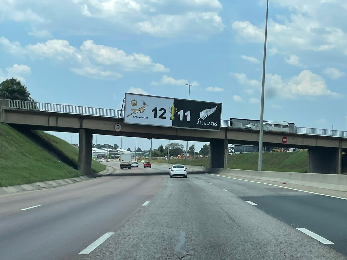 Sideline100's tweet photo. 📸🙌 Spotted on the R21 between OR Tambo and Pretoria.

Someone paid for a billboard showing the 2023 RWC final score. No branding. No company name. 

Whoever did this deserves the "South African of the Year Award" https://t.co/i23ZqSALbL