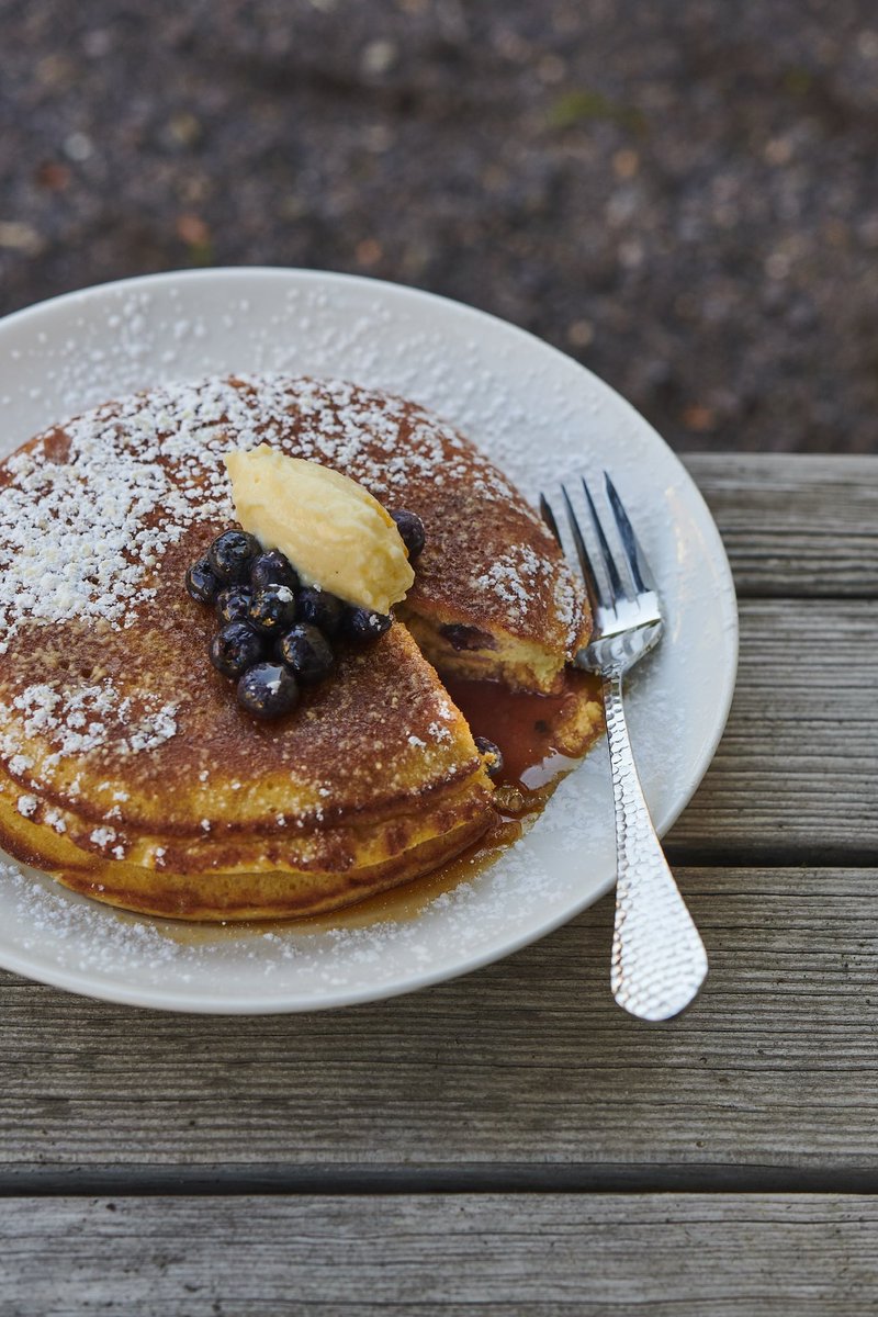 Our fluffy Buttermilk Pancakes are a guest favorite for a reason! Powdered sugar, a pat of butter, and a generous pour of maple syrup make it a classic. Blueberries optional (but highly recommended) 🫐🥞 We are now open daily from 9AM-3PM for brunch.