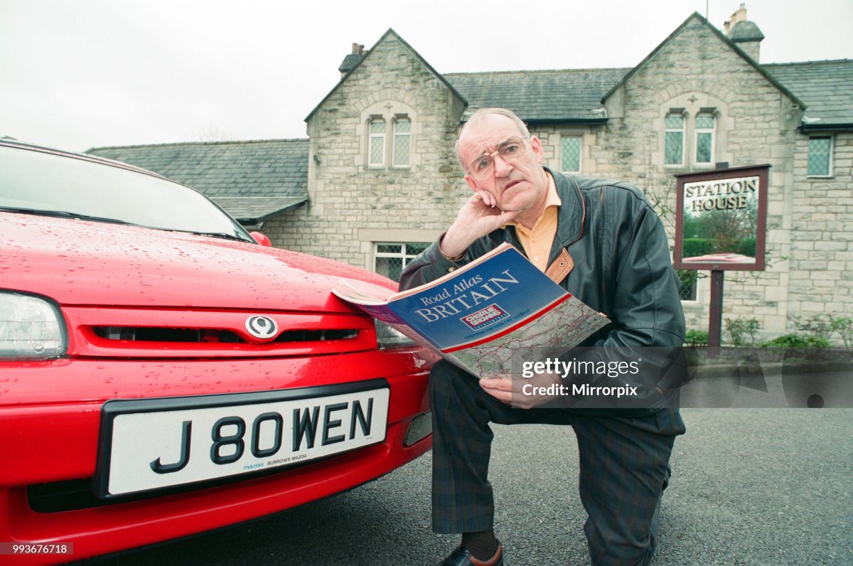 Jim Bowen by the railway which passes by his house in Arkholme, Lancashire (1993)