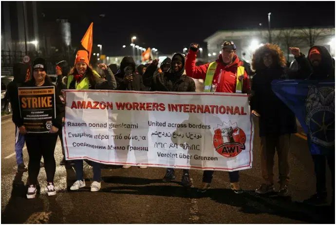 GlobalBrandsMag's tweet photo. Amazon workers demand £15/hour in #BlackFridayProtests across Europe. "Make Amazon Pay" echoes the call for better conditions. Amazon's dominance scrutinized in the push for #FairPayNow. #AmazonWorkersRights

Read more: https://t.co/6mWPzNAvoX  #GlobalBrandsMagazine https://t.co/zMQVsOgkiR