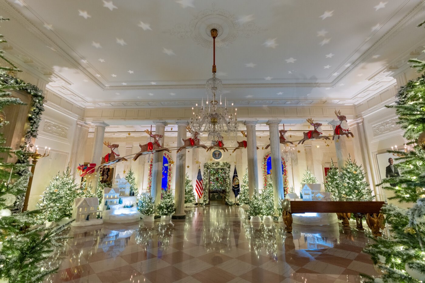 Thousands of Christmas ornaments adorn bar