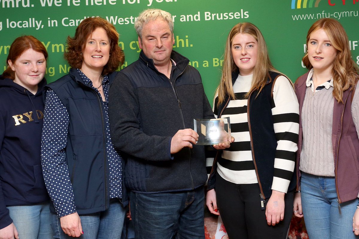 NFUCymru's tweet photo. Llongyfarchiadau mawr/Huge congratulations to Mark Davies, who has been announced as the winner of the NFU Cymru/@nfum Welsh Livestock Champion of the Year Award 2023.

Mark is pictured here receiving the award with his family.

Read all about the farm ➡️https://t.co/XhXFzeVdRg https://t.co/VSFrKhyGeP