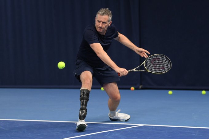Photo of Adam Hills playing at the Para-Standing Tennis Day at the National Tennis Centre