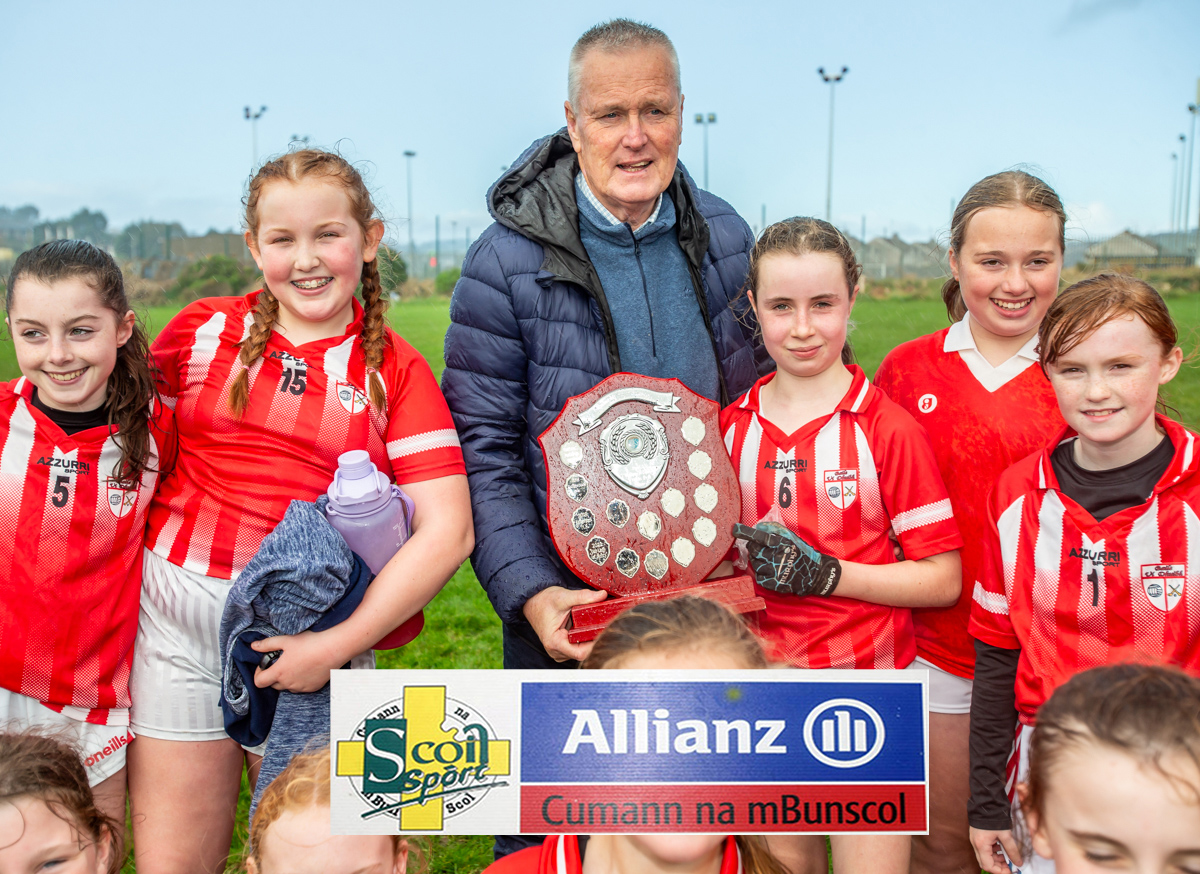 Ballyduff Captain and Player of the Match, Aisling Counihan, receives the U13 B honours on behalf of her team mates from East Waterford Cumann na mBunscol Chairman, Tim O'Byrne.