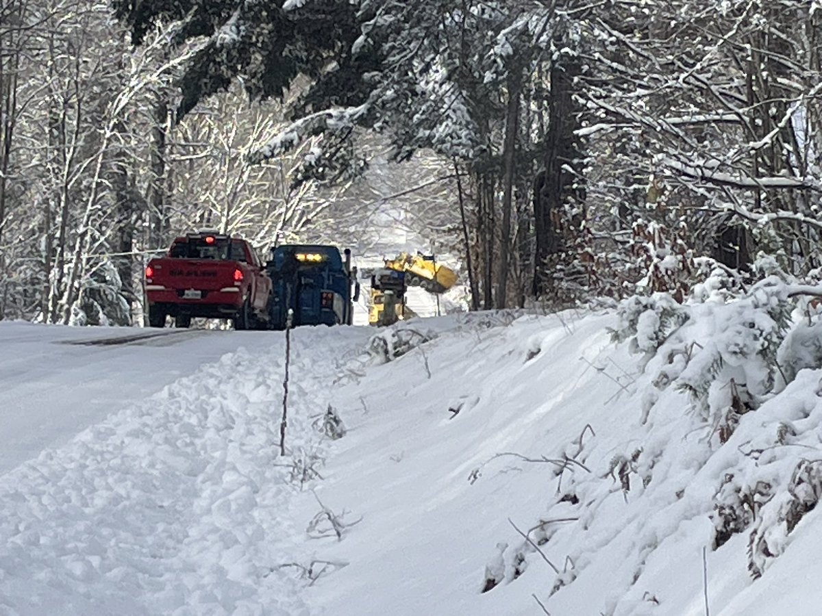 Snow plow in the ditch on East Waseosa Lake Road blocking the road as well
