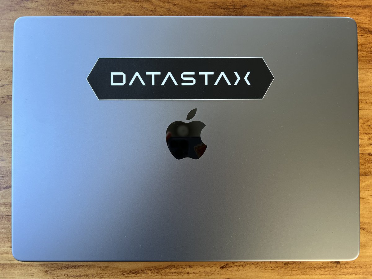 DataStax sticker on a Mac laptop