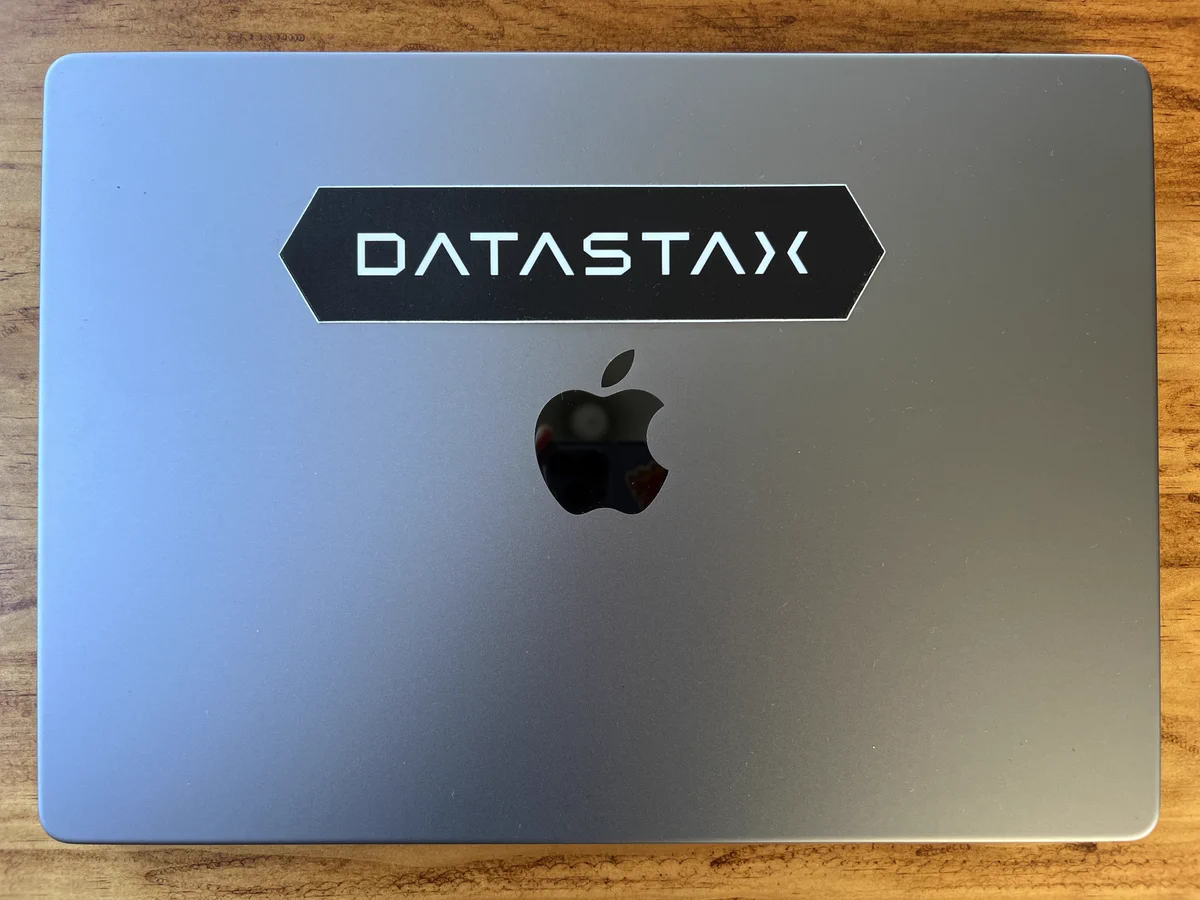 DataStax sticker on a Mac laptop