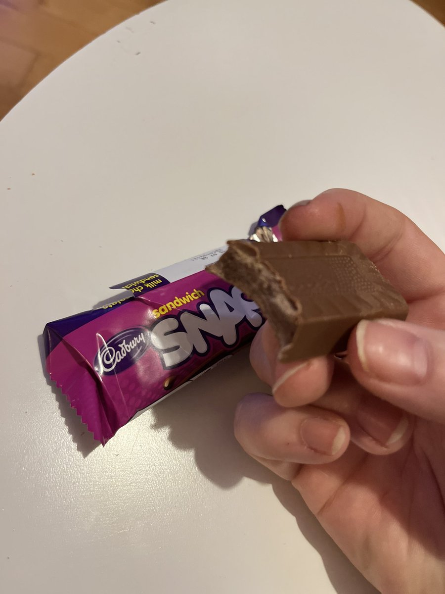 bishop_nic's tweet photo. @CadburyIreland  is this the latest in srinkflation? Got a purple snack with no biscuit 😆 Cadbury I think your machines need calibration! 🤣 https://t.co/9siBCUySyv