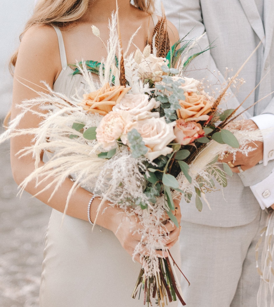 Crafted as a boho symphony in petals, this bridal bouquet becomes a poetic expression of love's untamed beauty, with each flower mirroring the delicate intricacies found in the heart of nature. 🌷💖 

#Weddingplanning #destination #Weddinginspo #BohoBouquet