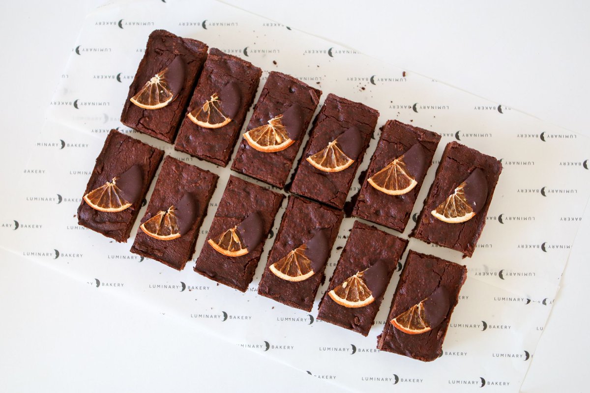 Introducing our dark chocolate brownies, crafted with a rich blend of 70% dark chocolate and invigorating zesty orange extract. These make an excellent gift or a perfect addition to your festive gathering. buff.ly/3MOauRk