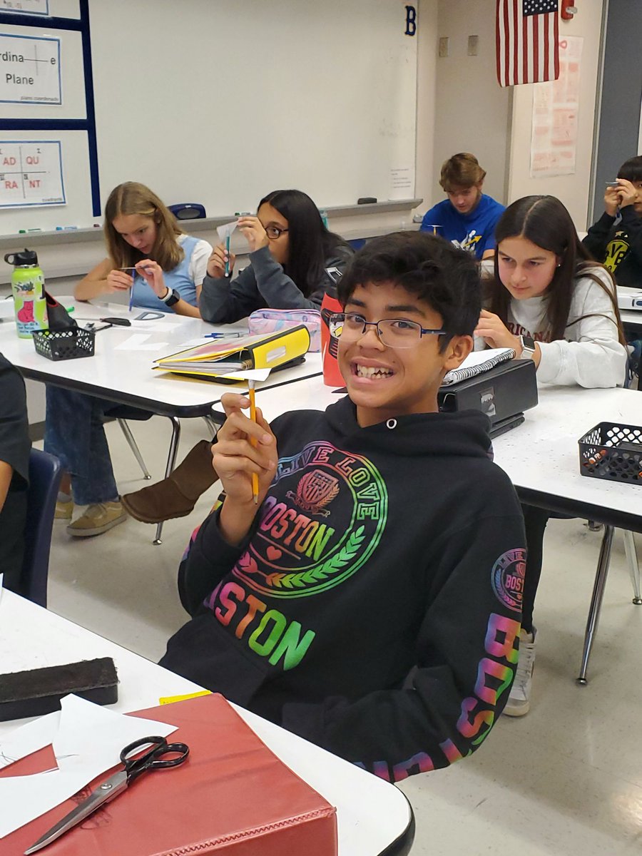 In Ms. McCall's class, Geometry Honors students constructed the medians using their compass and straightedge and balanced triangles on the centroid.