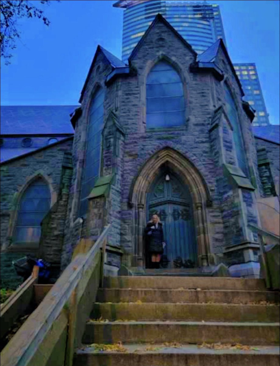 FlaneuseEnVille's tweet photo. A photo my friend took of me before the Depeche Mode concert held at the Bell Center in Montreal on Friday, November  3rd. I am standing at the side door of St. George’s Anglican Church. I like the eerie Gothic vibe here...Very appropriate before enjoying the dark sound of DM... https://t.co/sG1FE50Pxu