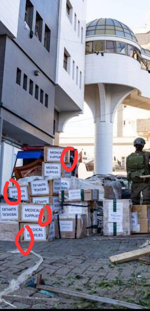 A sensational scandal for the Israeli occupation army at Al-Shifa Hospital. The occupation army brought crates this morning, claiming they contained aid for Al-Shifa Hospital. They transferred them inside the hospital, but the crates actually held weapons, clothing, and